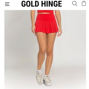 Pair of two gold hinge tennis skirts